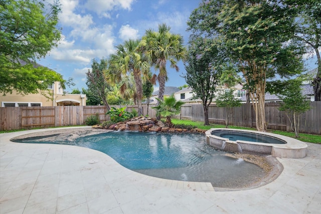 view of pool featuring a patio, a fenced backyard, and a pool with connected hot tub