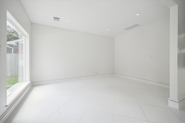 spare room with recessed lighting, visible vents, and light tile patterned floors