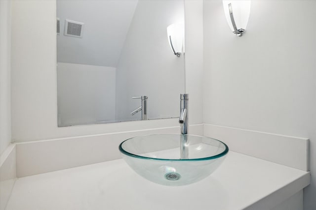 bathroom with vanity and visible vents