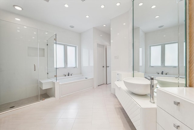 full bath with recessed lighting, vanity, a bath, tile patterned floors, and a stall shower