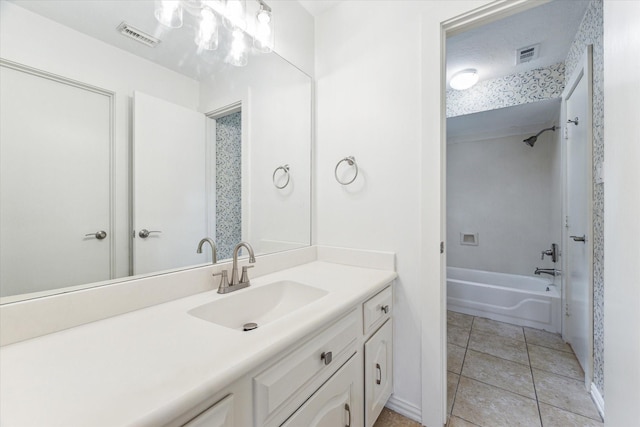 full bath with shower / bathing tub combination, vanity, visible vents, and tile patterned floors