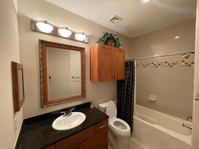 bathroom featuring shower / tub combo, visible vents, vanity, and toilet