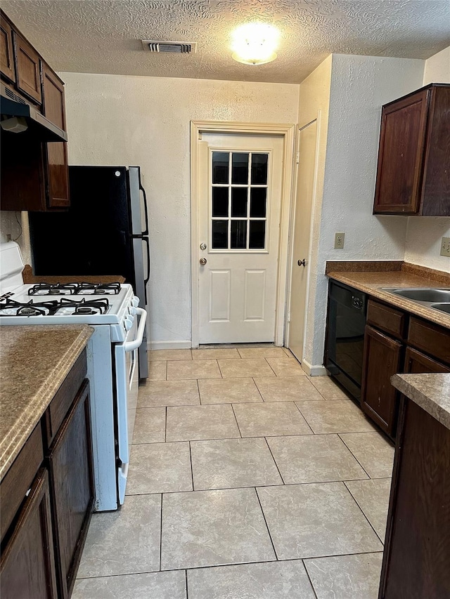 kitchen featuring black dishwasher, gas range gas stove, dark brown cabinetry, a textured ceiling, and under cabinet range hood