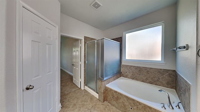 full bath with a garden tub, a shower stall, visible vents, and tile patterned floors