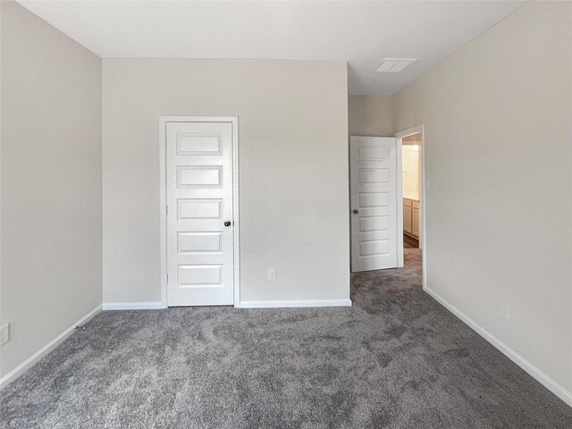 27407 Axis Deer Trl, Magnolia, TX 77354 - unfurnished bedroom with visible vents, baseboards, and dark carpet