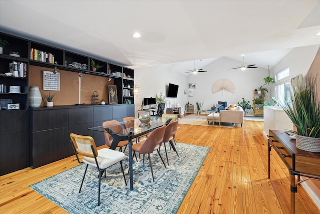 dining space featuring a ceiling fan, hardwood / wood-style flooring, vaulted ceiling, built in shelves, and recessed lighting