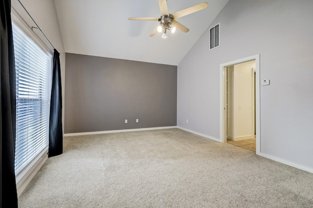 empty room featuring a ceiling fan, baseboards, visible vents, and carpet flooring