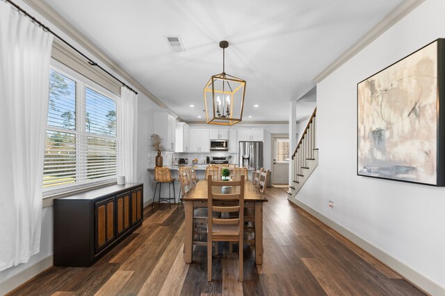 dining area with dark wood-style flooring, crown molding, baseboards, and stairs