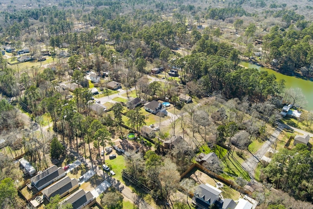 bird's eye view with a residential view and a water view