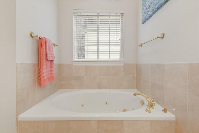 bathroom featuring a tub with jets