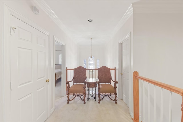 sitting room featuring light carpet, ornamental molding, and an upstairs landing