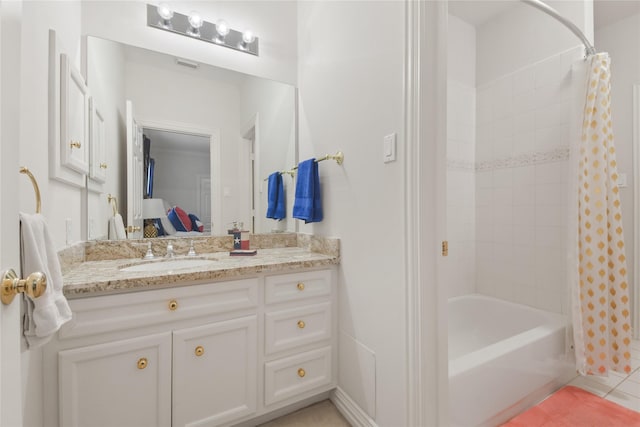 ensuite bathroom with shower / bath combo, vanity, ensuite bath, and tile patterned floors