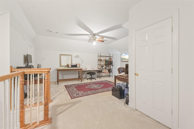 interior space with a ceiling fan, lofted ceiling, visible vents, and carpet flooring