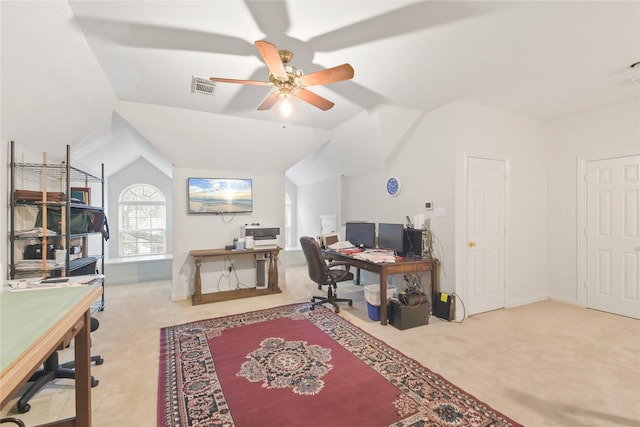 office space with light carpet, visible vents, baseboards, ceiling fan, and vaulted ceiling