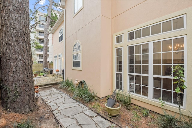 view of property exterior featuring a patio and stucco siding