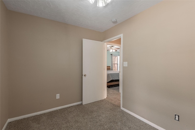 2 Brown Rd, Huntsville, TX 77320 - carpeted spare room with a textured ceiling and baseboards