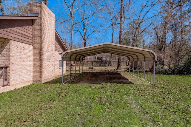 2 Brown Rd, Huntsville, TX 77320 - view of yard featuring driveway and a detached carport