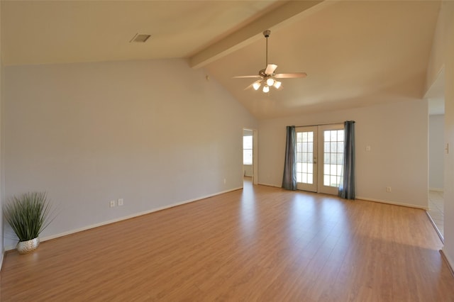 spare room with visible vents, a ceiling fan, wood finished floors, french doors, and beam ceiling