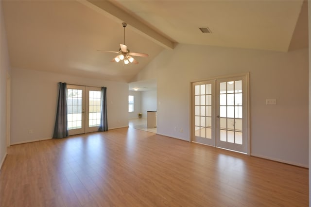 unfurnished living room featuring french doors, visible vents, a ceiling fan, light wood-type flooring, and beamed ceiling