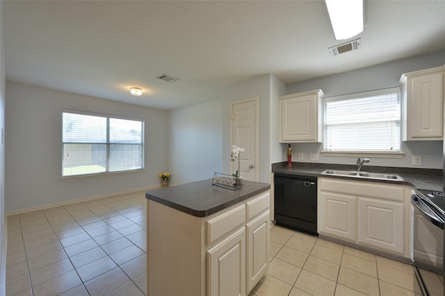 kitchen featuring visible vents, dark countertops, black appliances, a sink, and light tile patterned flooring