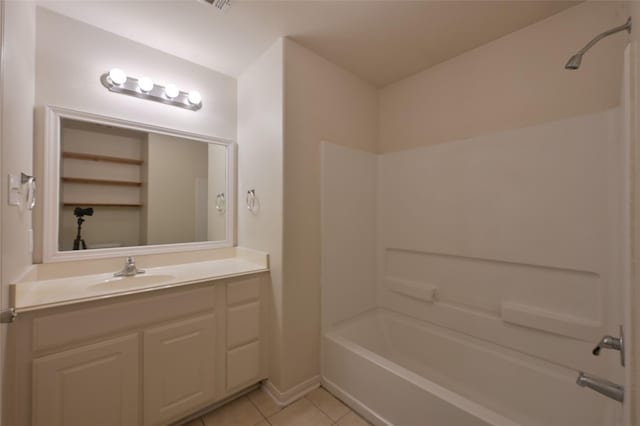 full bath with bathtub / shower combination, vanity, and tile patterned floors