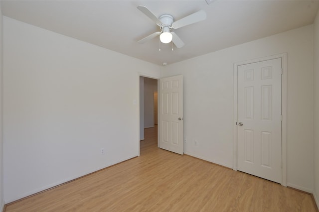 unfurnished bedroom featuring light wood-type flooring and ceiling fan