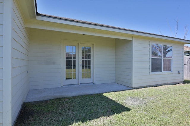 exterior space with french doors, a yard, and a patio