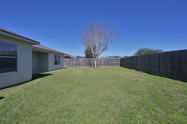 view of yard featuring a fenced backyard