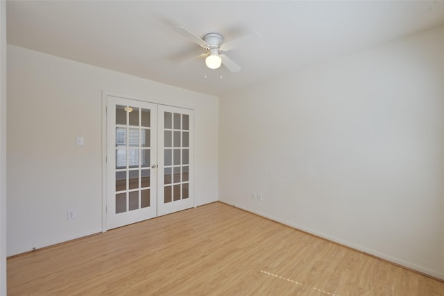 unfurnished room featuring french doors, light wood-style flooring, and a ceiling fan