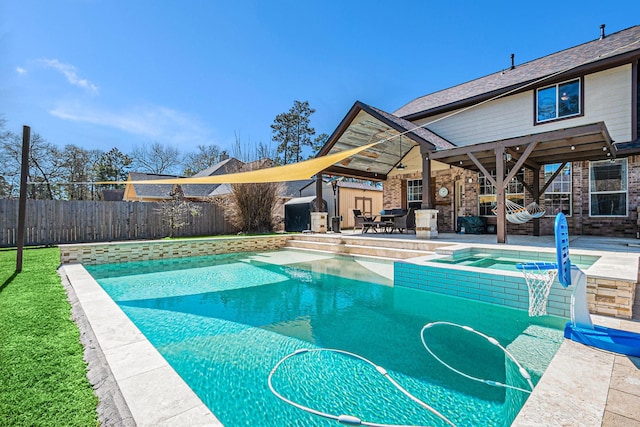 view of pool featuring a fenced in pool, a yard, a patio, an in ground hot tub, and a fenced backyard