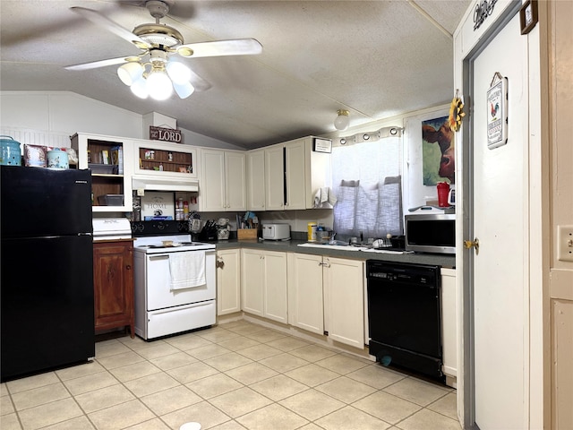 kitchen featuring dark countertops, light tile patterned flooring, vaulted ceiling, a textured ceiling, and black appliances