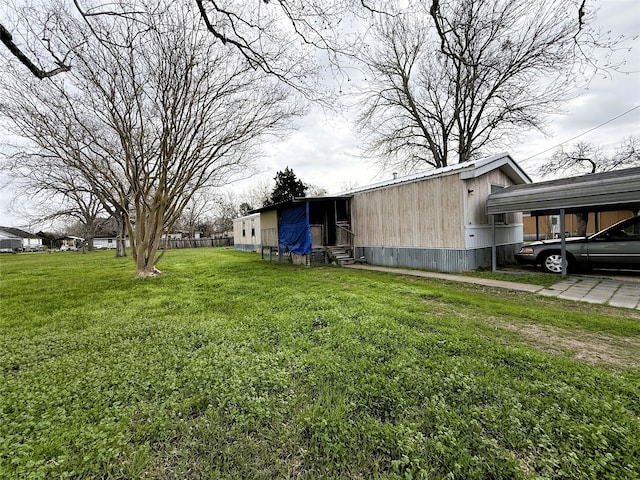 exterior space with entry steps and a carport