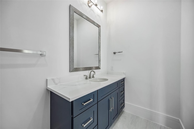 bathroom with vanity and baseboards