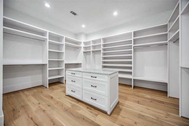 walk in closet featuring visible vents and light wood-style floors