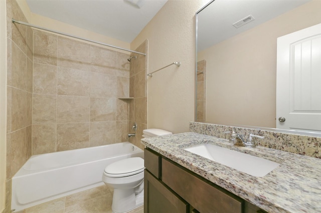 full bathroom featuring shower / bathtub combination, visible vents, toilet, vanity, and tile patterned floors