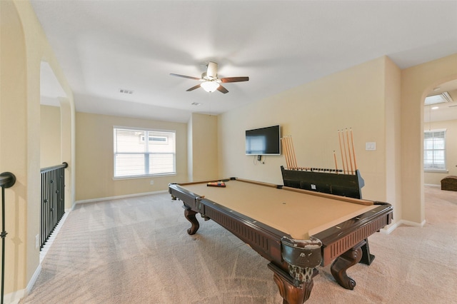 game room featuring baseboards, visible vents, and light colored carpet