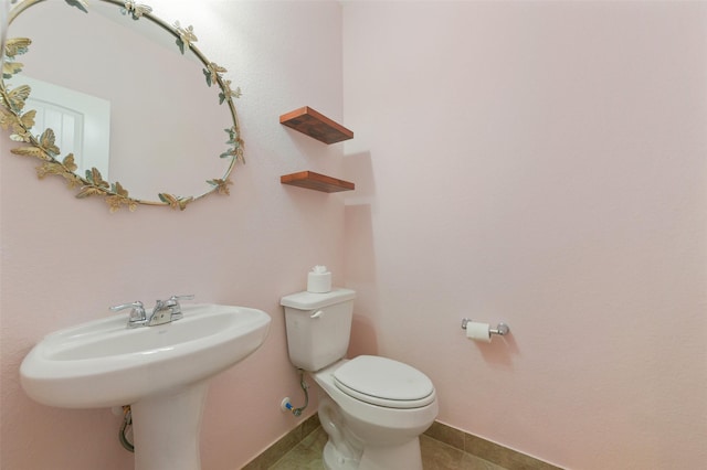 24030 Tirso River Ct, Katy, TX 77493 - half bath featuring tile patterned floors, baseboards, and toilet