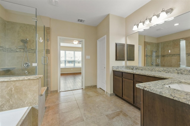 24030 Tirso River Ct, Katy, TX 77493 - full bathroom with a shower stall, vanity, visible vents, tile patterned floors, and baseboards