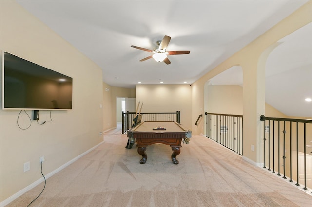 rec room with a ceiling fan, light colored carpet, and baseboards