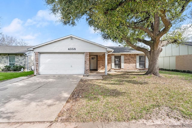 ranch-style home with an attached garage, brick siding, fence, driveway, and a front yard