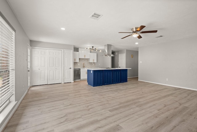 unfurnished living room featuring ceiling fan, baseboards, visible vents, and light wood-style floors