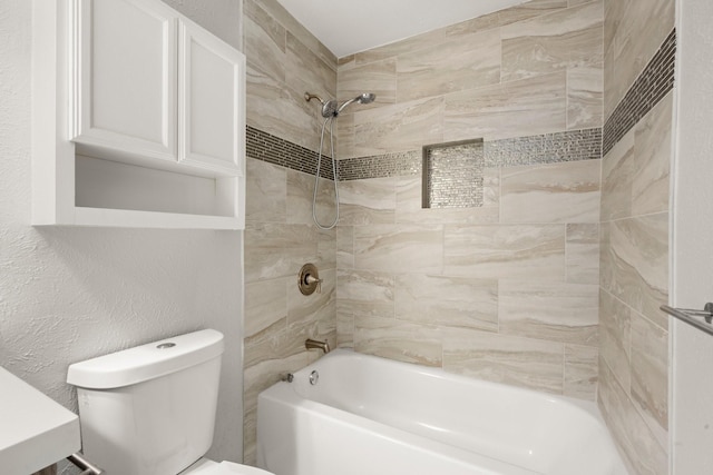 full bath featuring a textured wall, bathing tub / shower combination, and toilet