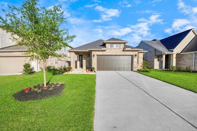 21311 Bridle Rose Trl, Tomball, TX 77377 - view of front of property featuring a front lawn, a garage, and concrete driveway