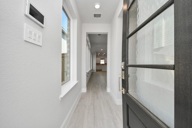 21311 Bridle Rose Trl, Tomball, TX 77377 - hallway featuring visible vents and baseboards