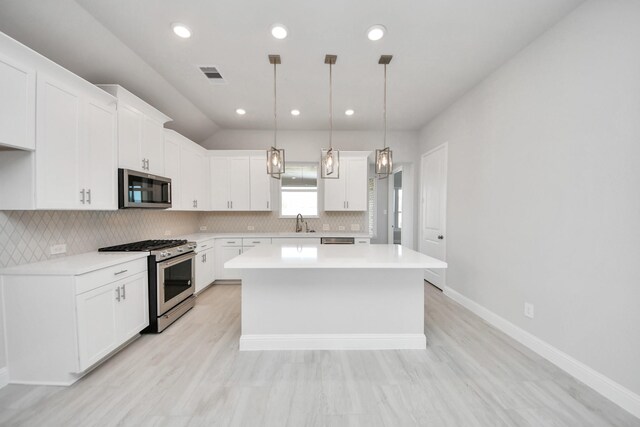 21311 Bridle Rose Trl, Tomball, TX 77377 - kitchen with light countertops, a sink, visible vents, and stainless steel appliances
