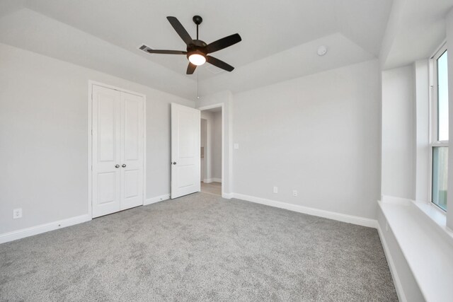 21311 Bridle Rose Trl, Tomball, TX 77377 - unfurnished bedroom featuring a closet, ceiling fan, carpet flooring, and baseboards