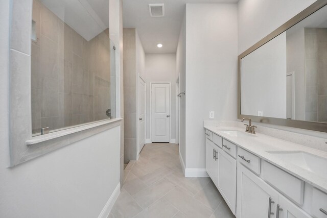 21311 Bridle Rose Trl, Tomball, TX 77377 - bathroom featuring a sink, visible vents, walk in shower, and double vanity