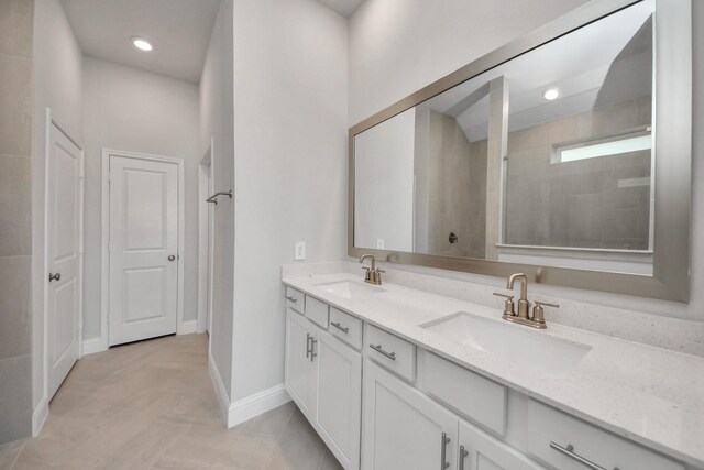 21311 Bridle Rose Trl, Tomball, TX 77377 - bathroom featuring a walk in shower, recessed lighting, double vanity, and a sink