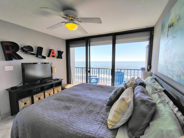 bedroom featuring ceiling fan and access to exterior