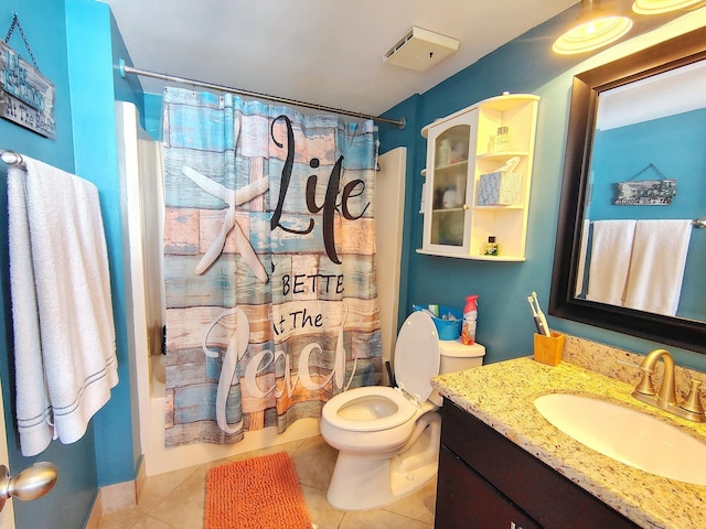 full bath with toilet, shower / tub combo, vanity, and tile patterned floors